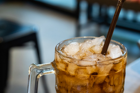Carbonated water with ice in a glass on the table.の写真素材