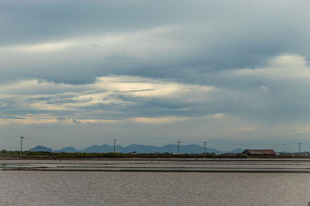 Sunset light reflects from the surface of the water.の写真素材