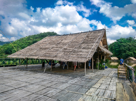 The wooden raft in the water reservoirs and mountain views.の写真素材