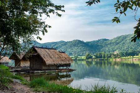 The wooden raft in the water reservoirs and mountain views.の写真素材