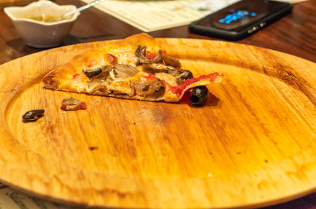 Pizza on a wood tray.の写真素材