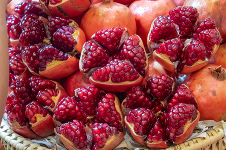 Ripe pomegranate fruit on bamboo basket With bright red delicious.の写真素材