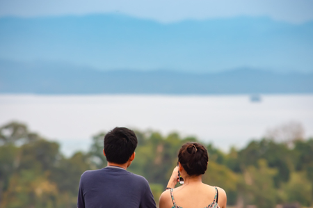 Tourists watch view  Srinakarin Dam at Huay Mae khamin waterfall National Park ,Kanchana buri in Thailand.の写真素材