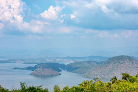 The beauty inside the dam and the houseboat on the bright sky at Sri Nakarin dam , Kanchana buri in Thailand.の写真素材
