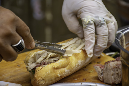 Baguette with meat and veggies and seasoning or Khowjee pate is popular original from France.の写真素材