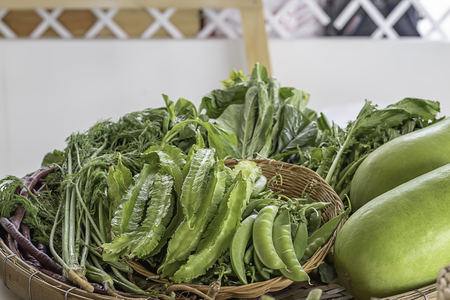 Vegetables in Thailand , Winged Bean , Peas and Winter melon in bamboo baskets.の写真素材