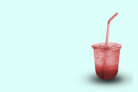 Red juice with ice in a plastic glass with clipping path.の写真素材