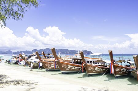 Lots of boat tours and tourists on the beach at Poda island , Krabi in Thailand. October 13, 2019.のeditorial素材