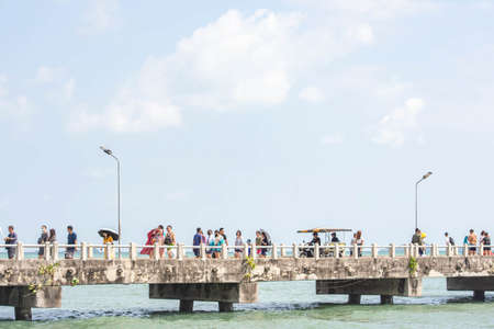 Tourists walk on the concrete bridge at Ban Phe Pier , Rayong in Thailand. January 25, 2020のeditorial素材