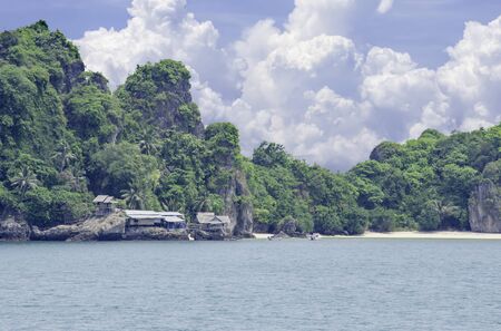 Wooden houses built on rocks in the koh Maphrao at Chumphon in Thailand.の写真素材