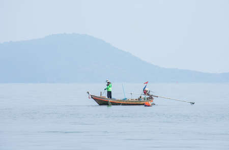 Fishermen netting fish on a boat at sea at Koh Talu , Prachuap Khiri Khan in Thailand. March 16, 2020のeditorial素材