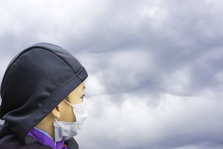 Boys wear a mask to prevent dust in Bangkok ,Thailand.