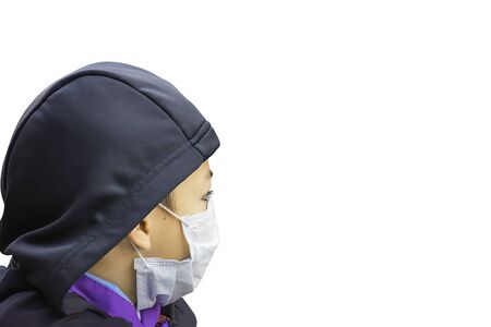 isolated  Boys wear a mask to prevent dust on a white background.の写真素材