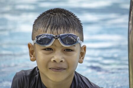 boys are swimming in the pool.の写真素材