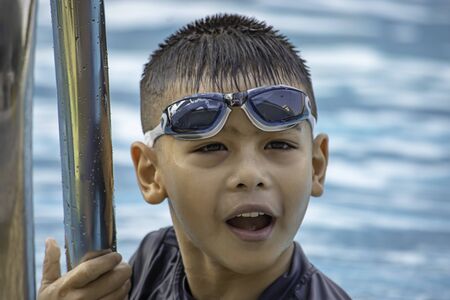 boys are swimming in the pool.の写真素材