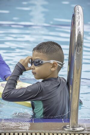 boys are swimming in the pool.の写真素材