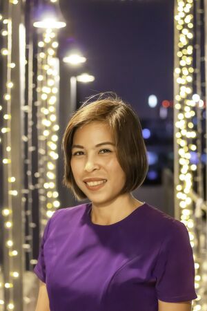 Portrait Asian woman smiling Background lightingの写真素材
