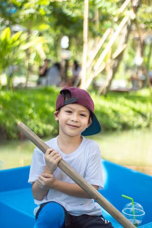 The boy boating in the park.の写真素材