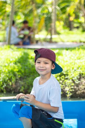 The boy boating in the park.の写真素材