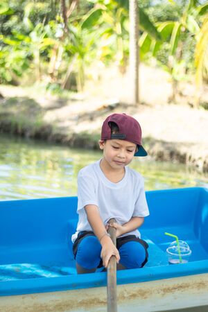 The boy boating in the park.の写真素材