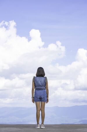 The image behind the women  looked at the mountains and trees at Kilom Viewpoint ,Mae Hong Son in Thailand.の写真素材