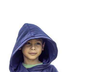 Isolated Portrait of Asian boy wearing a blue coat and  smile on a white background with clipping path.の写真素材