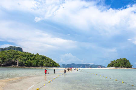 Many tourists Walk on the sand dunes at low tide between two islands Background Beautiful sky and sunlight at Thale Waek (Separated Sea) in Krabi , Thailand. October 13 , 2019のeditorial素材