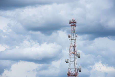 Wave transmission mast large phone signal with a bright blue sky.