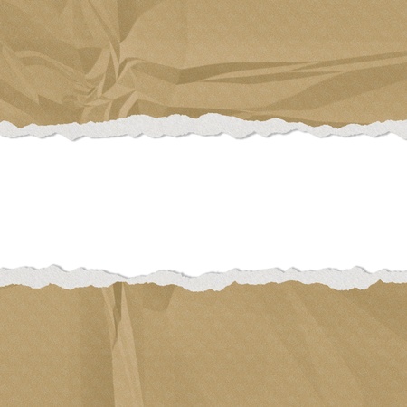 Hole in the brown paper with torn sides paper textureの写真素材