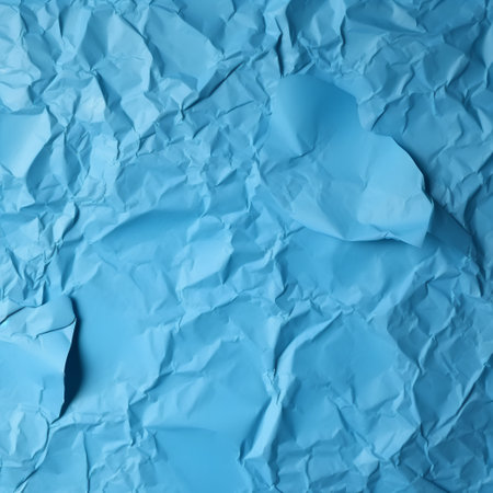 Blue crumpled paper background. Crumpled blue paper textureの素材