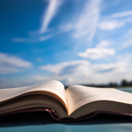 Open book on blue sky background. Shallow depth of field.の素材