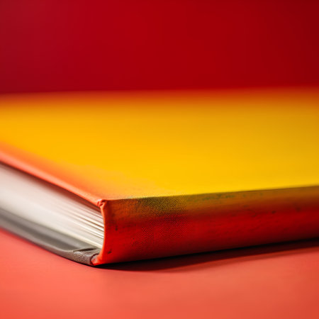 Close-up of a book on a red background with copy spaceの素材