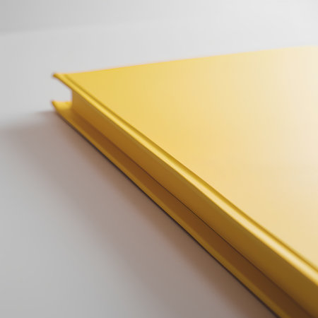 close up of yellow book on white background with shallow depth of fieldの素材