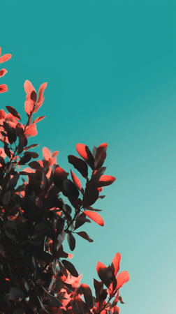 Close up of red leaves with blue sky background in vintage style.の素材