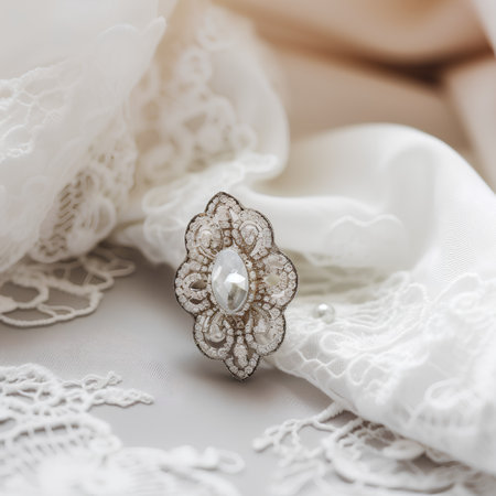 Wedding rings on a white lace background. Wedding details.の素材