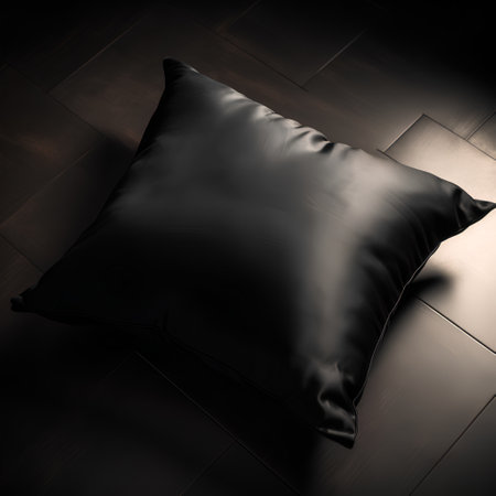 Black pillow on a dark wooden floor. 3d render image.の素材