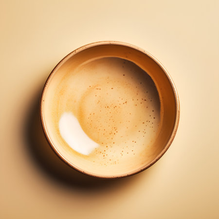 Empty ceramic bowl on a beige background. Top view. Flat lay.の素材