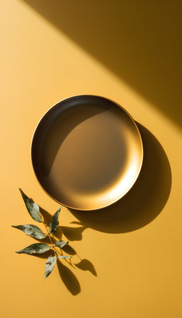 Empty plate on yellow background with shadows. Flat lay, top view.の素材