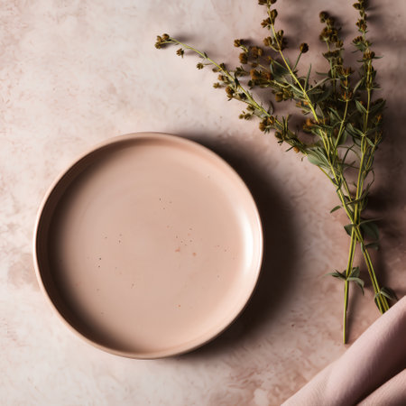 Empty plate and dried flowersle background. Flat lay, top viewの素材