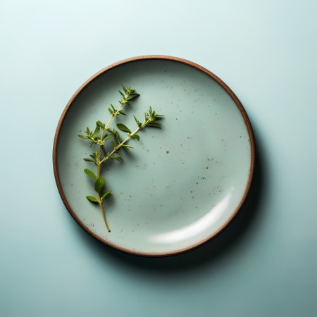 Plate with thyme on blue background. Flat lay, top viewの素材