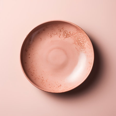 Empty ceramic plate on pink background. Top view. Minimal style.の素材