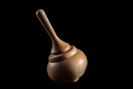 Wooden honey dipper isolated on black background, clipping path includedの素材