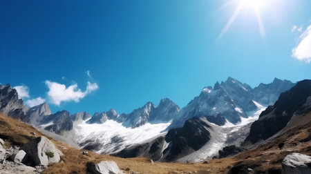 Beautiful mountain landscape with snow-capped peaks and blue skyの素材