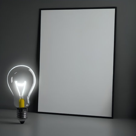 Light bulb with blank frame on grey wall background, 3d renderの素材