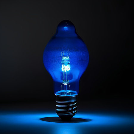 Blue lightbulb on dark background. 3d render illustration.の素材