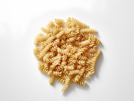 Fusilli pasta on white background, top view. Flat layの素材