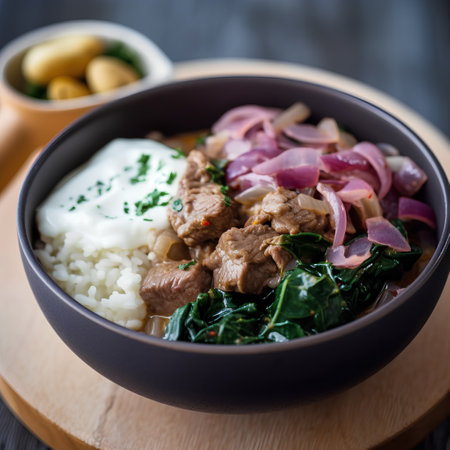 Bowl of rice with beef, spinach, onion and sour cream.の素材