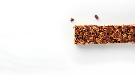 High angle view of granola bar on white background with copy spaceの素材