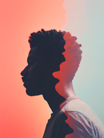 Side view of african american man looking away against gradient backgroundの素材