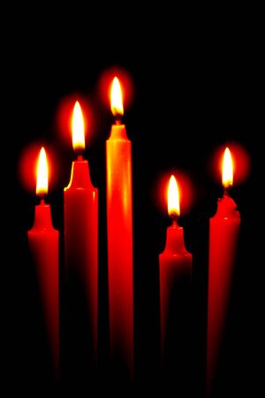 Red candle on a black background in the dark, close-up,Candles , Burn candles at night Candle light on black backgroundの写真素材
